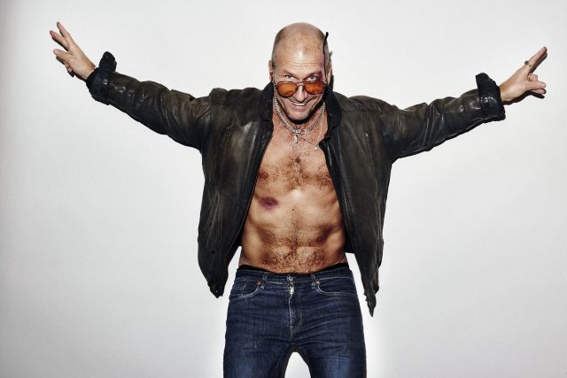 a man with a leather jacket and sunglasses
