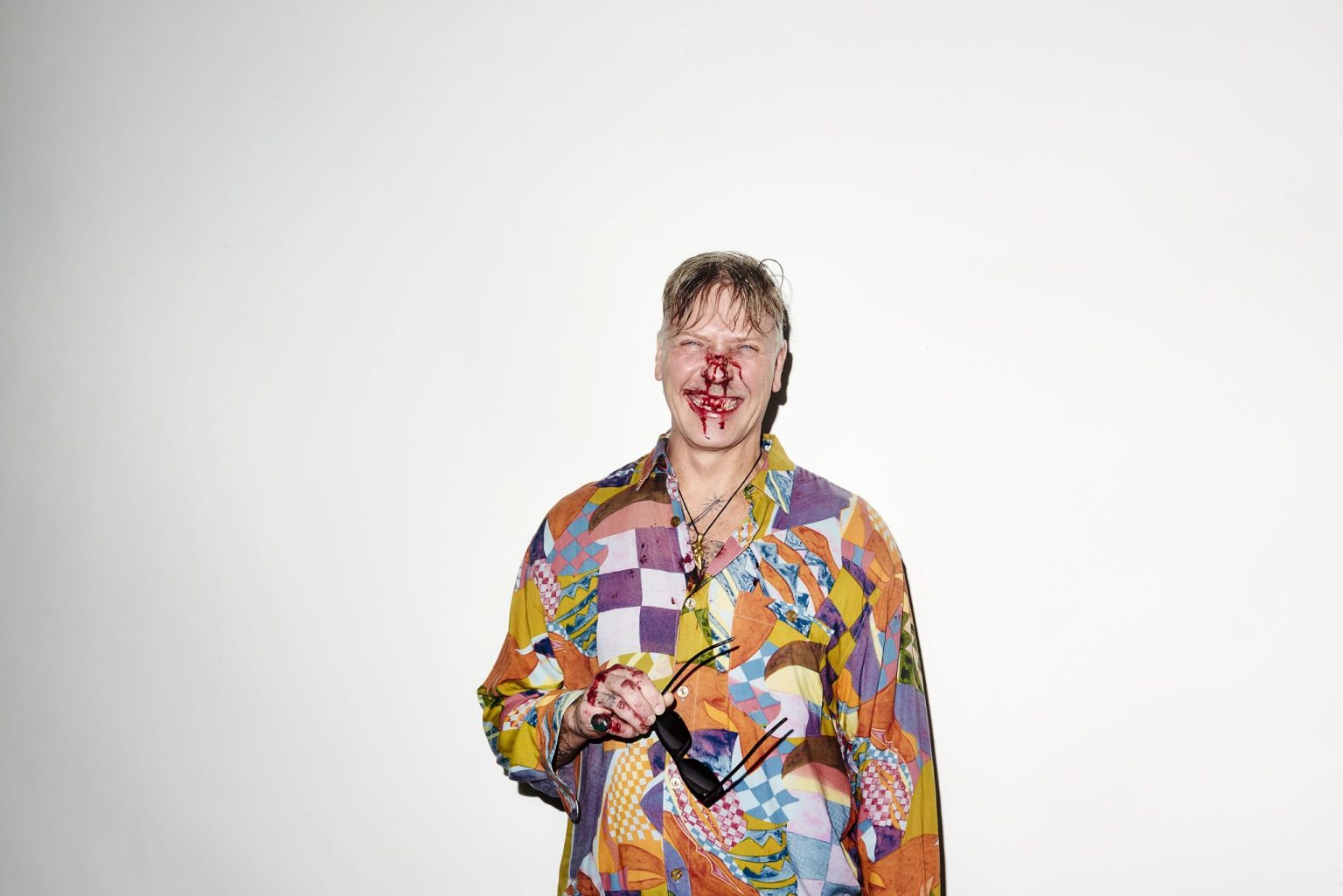 a man with blood on his face