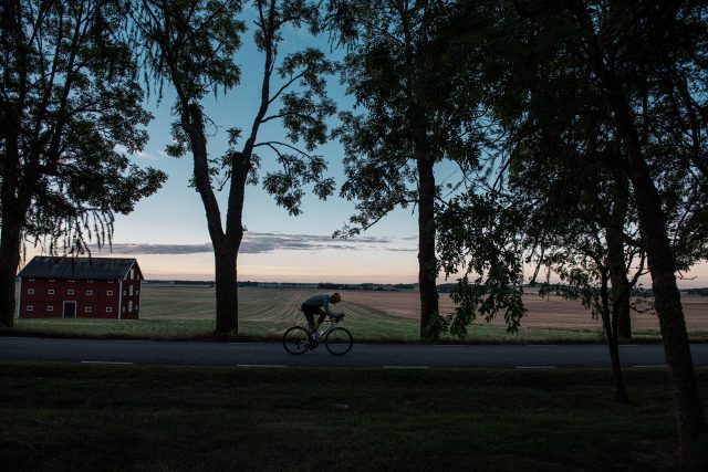 a person riding a bicycle on a road