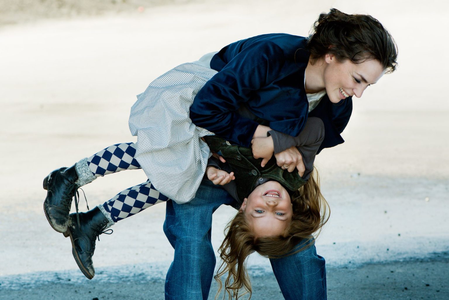 a woman holding a child