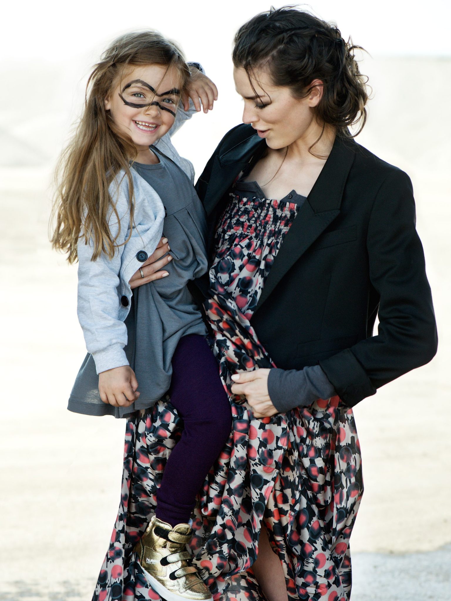 a woman holding a girl