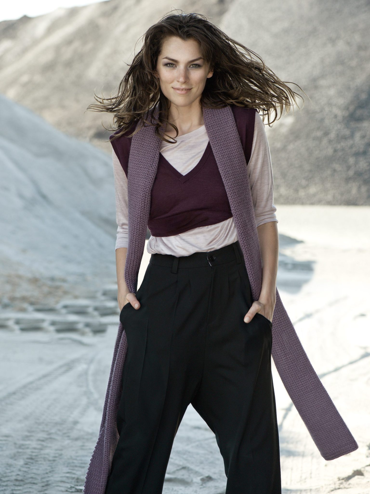 a woman with long hair wearing a scarf