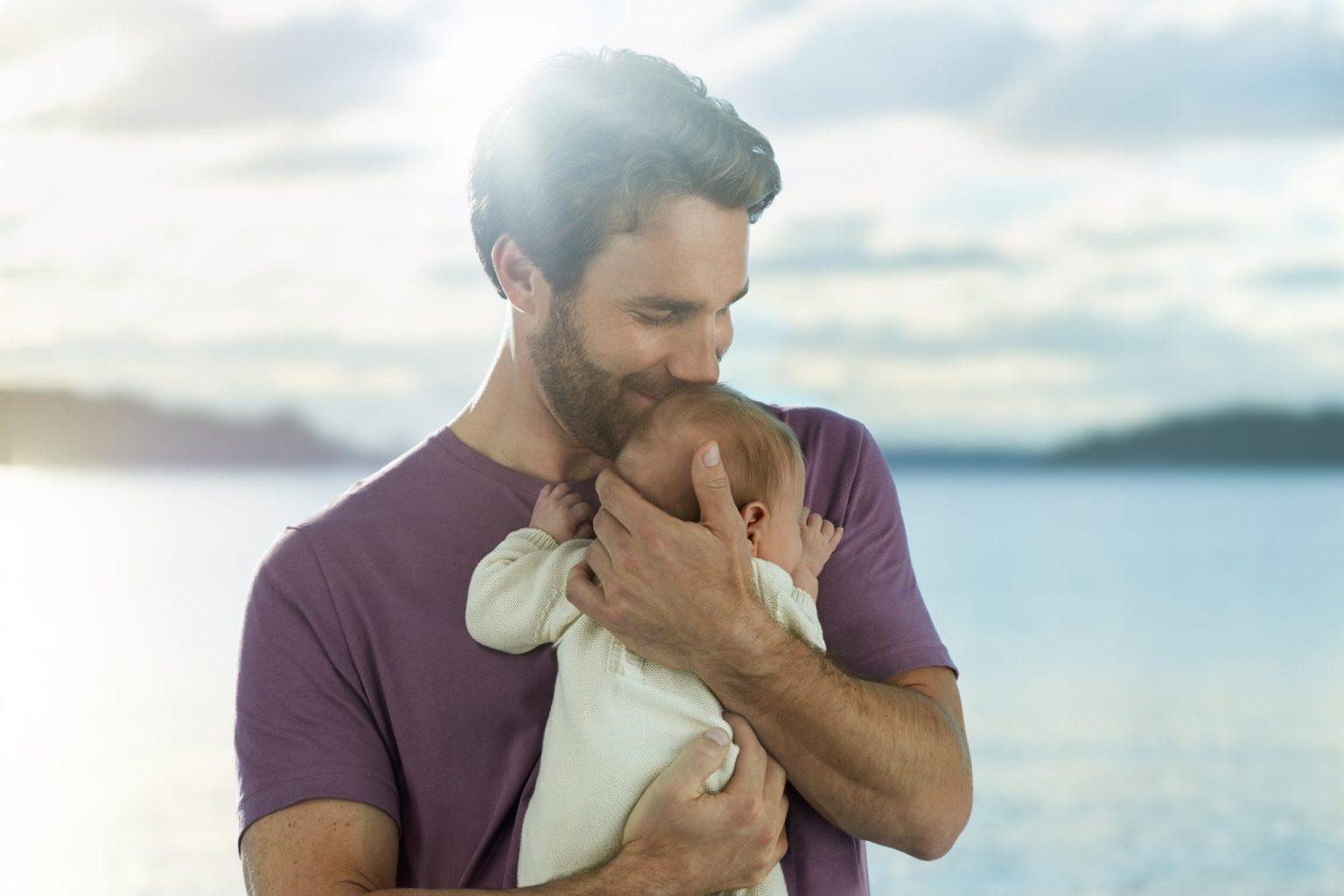 a man holding a baby