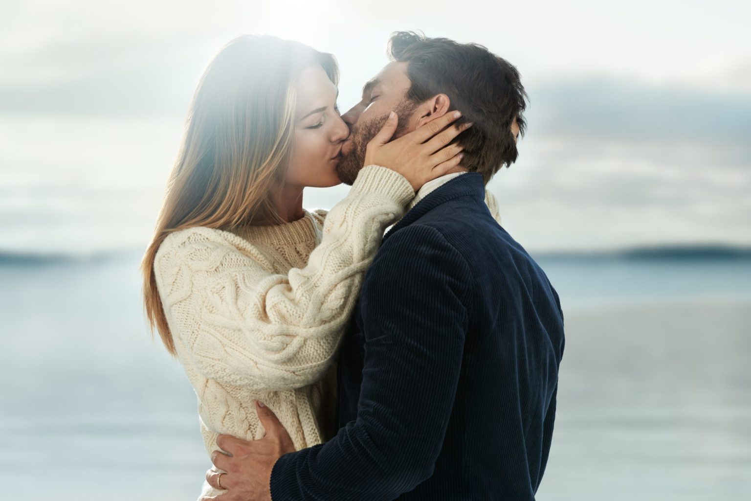 a man and woman kissing