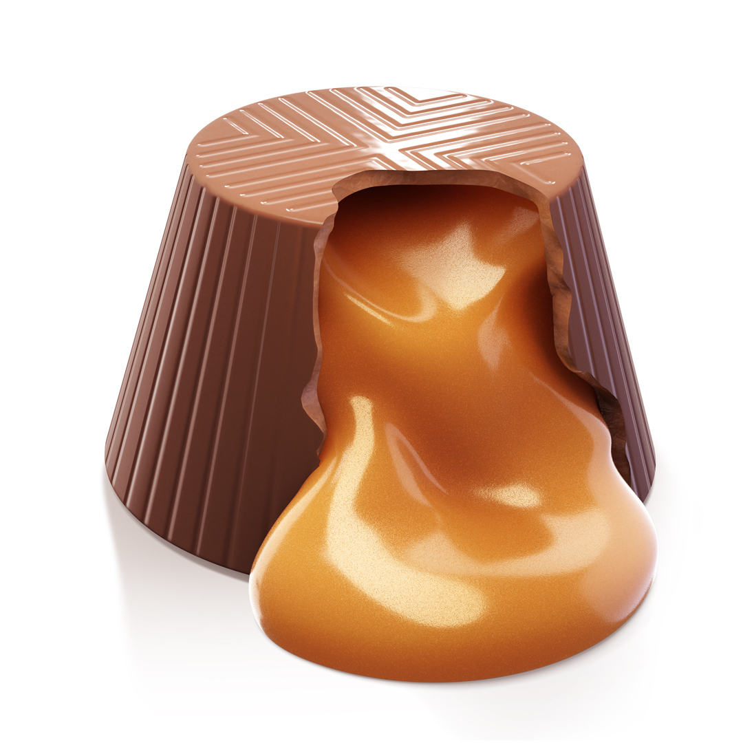 a chocolate candy with caramel flowing out of it