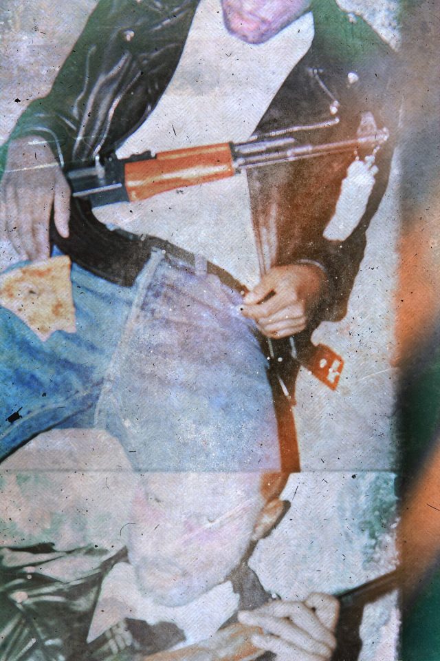 a man holding a gun
