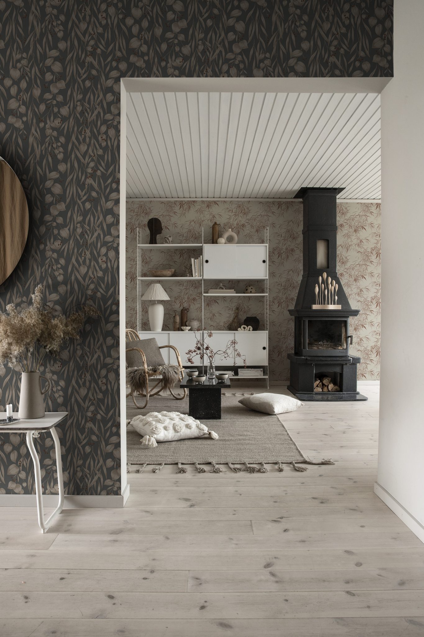 a room with a fireplace and a white shelf