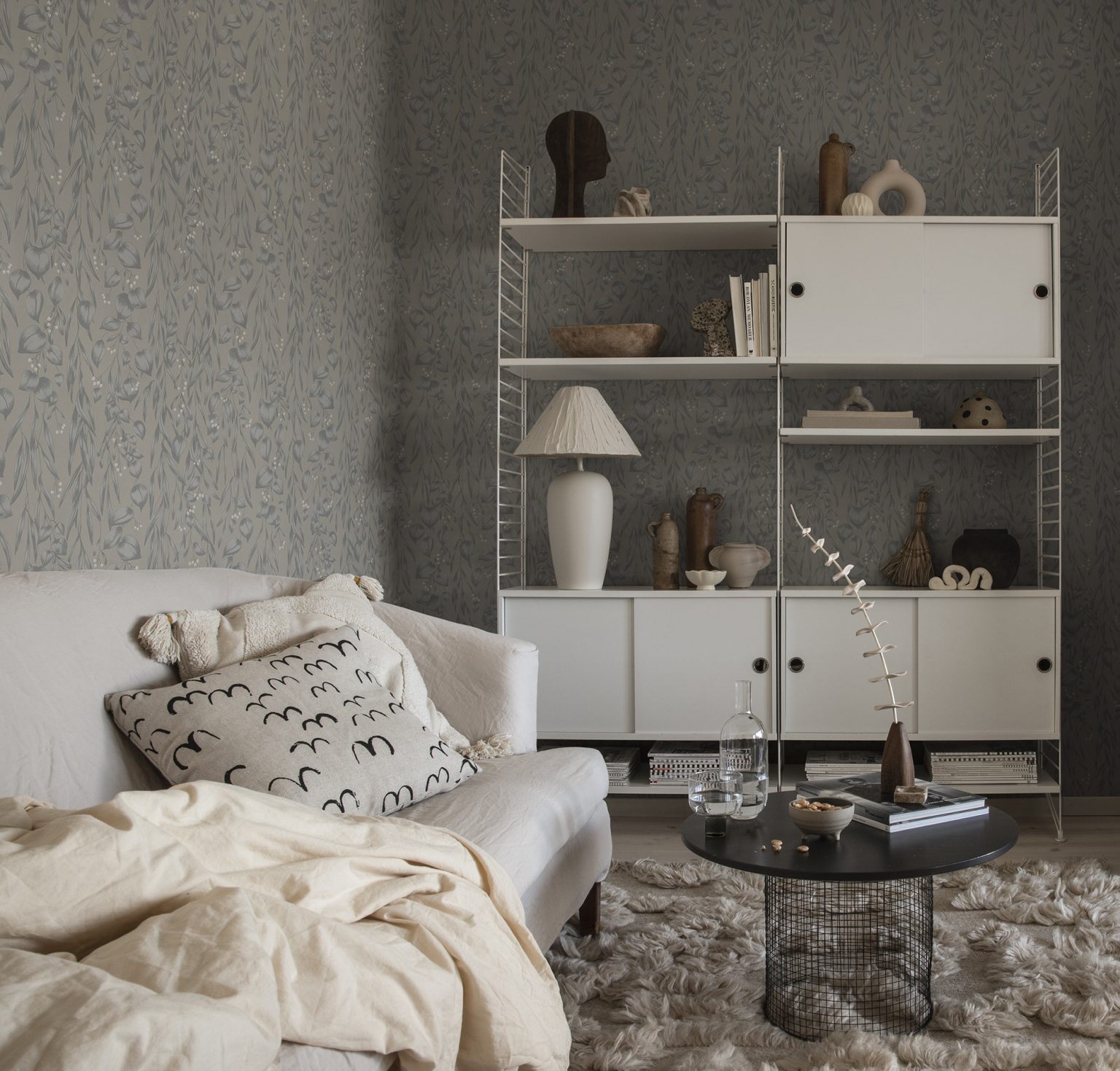 a living room with a couch and a rug