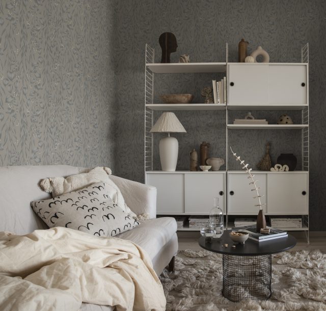 a living room with a couch and a rug