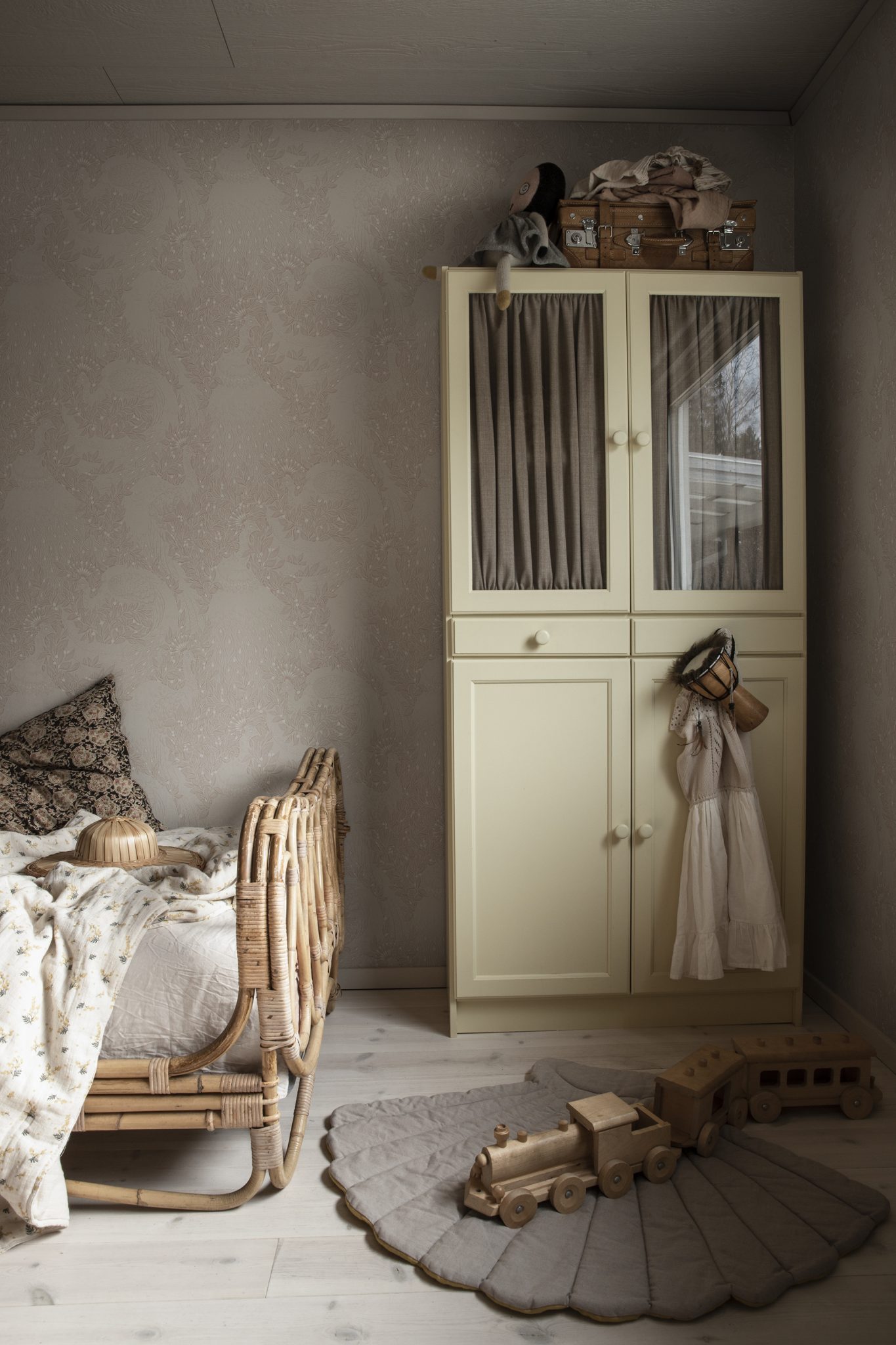 a bedroom with a bed and a cabinet