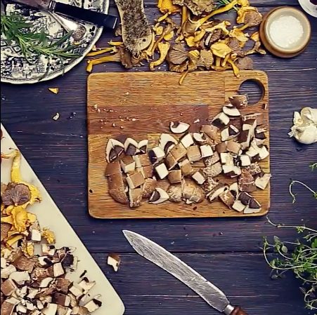 a cutting board with mushrooms on it