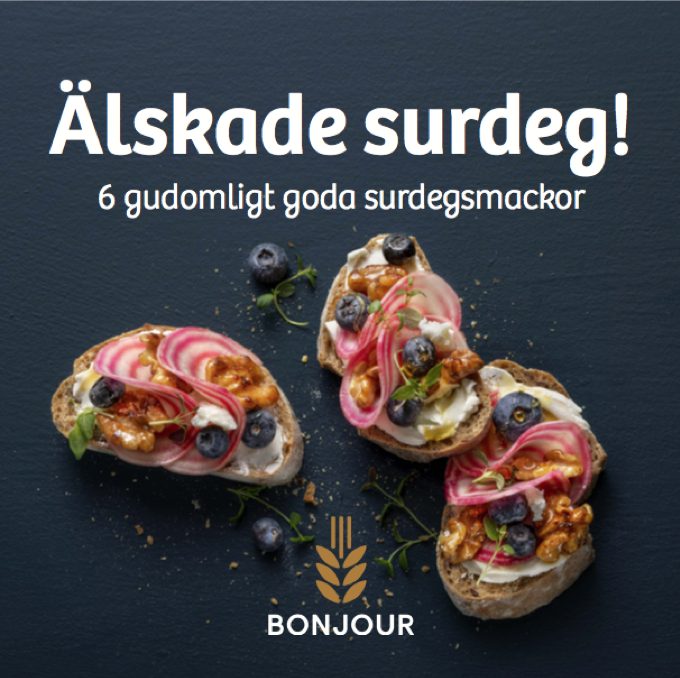 a group of sandwiches with blueberries and cheese