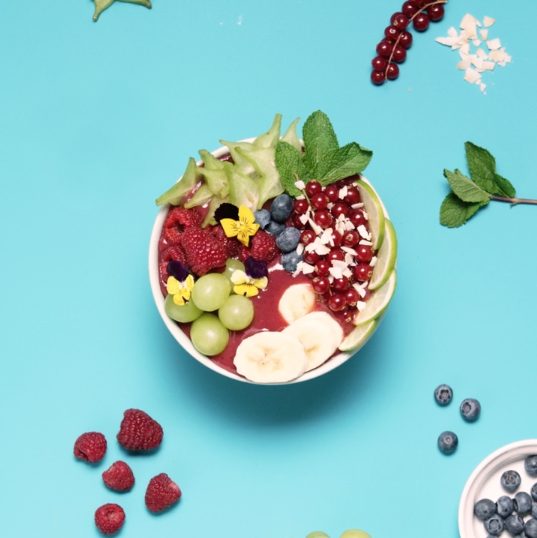 a bowl of fruit and berries
