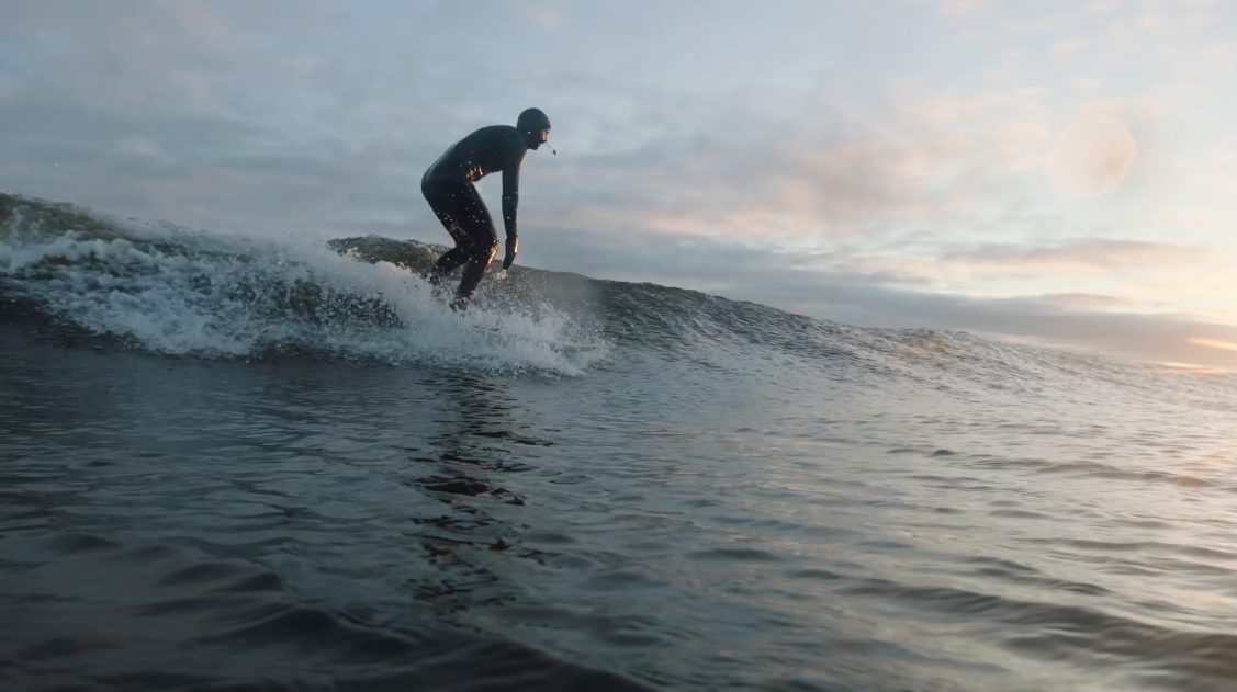 a person surfing on a wave