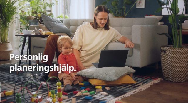 a man and child sitting on the floor with a laptop