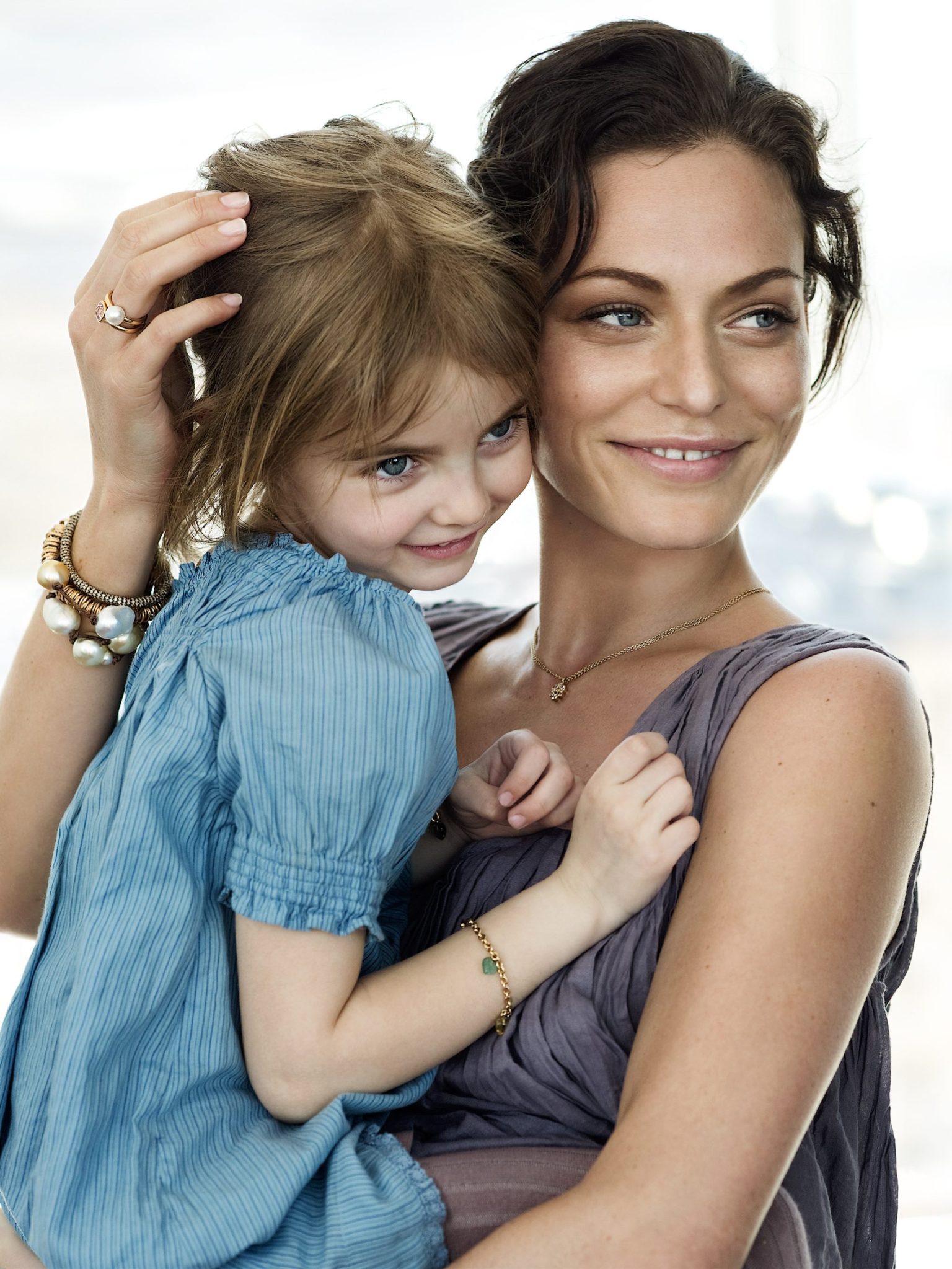 a woman holding a child