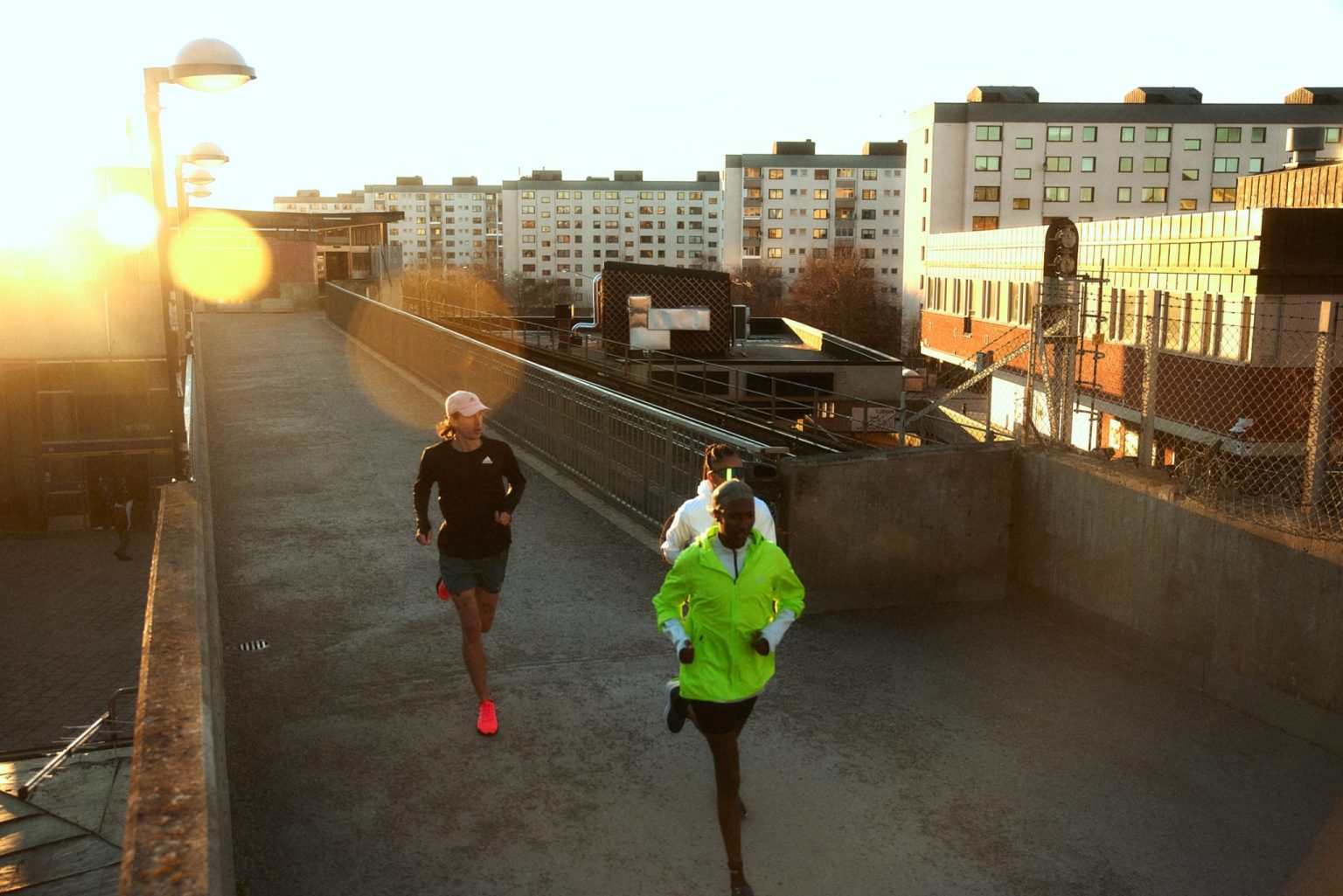 a group of people running on a rooftop
