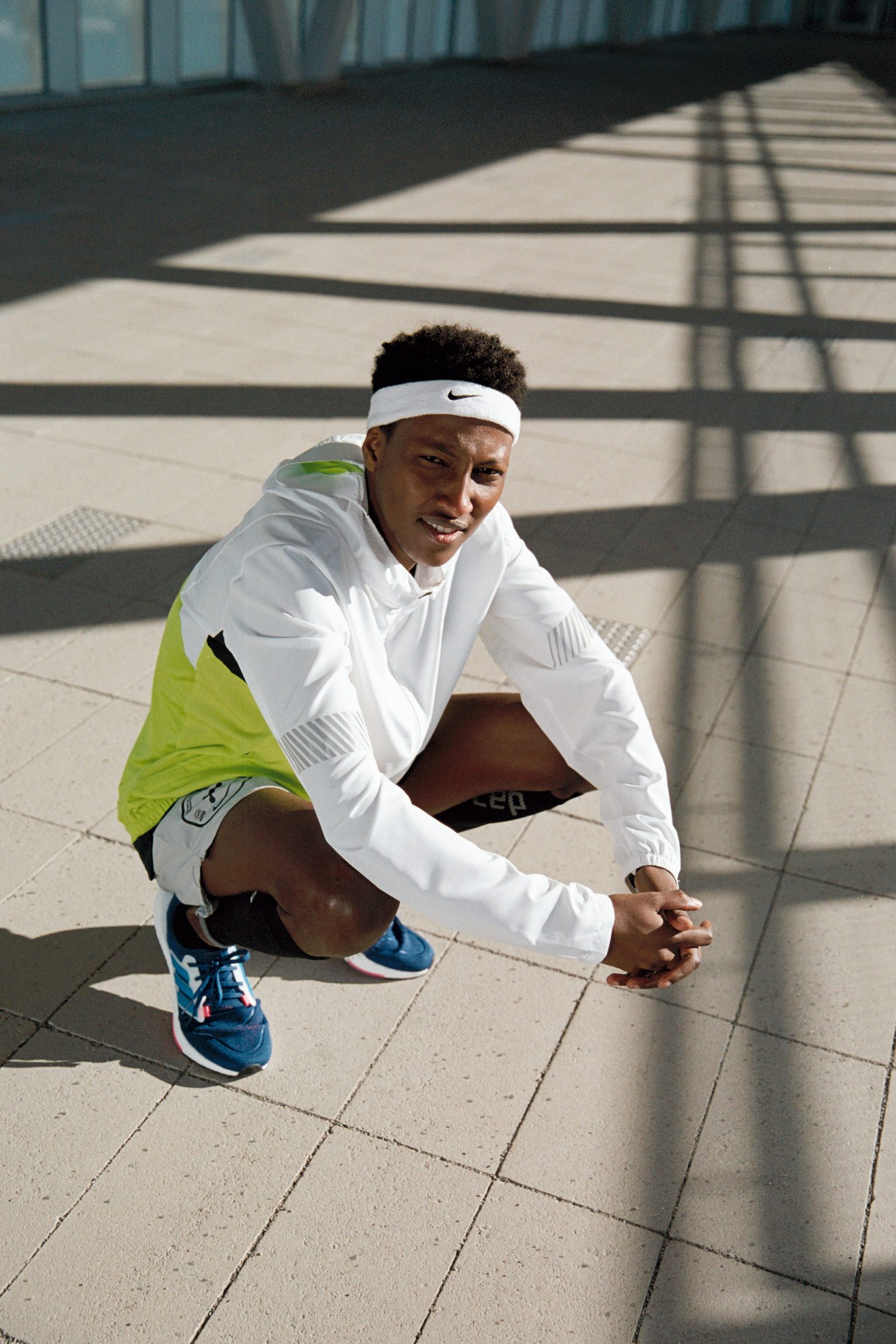 a man squatting on the ground