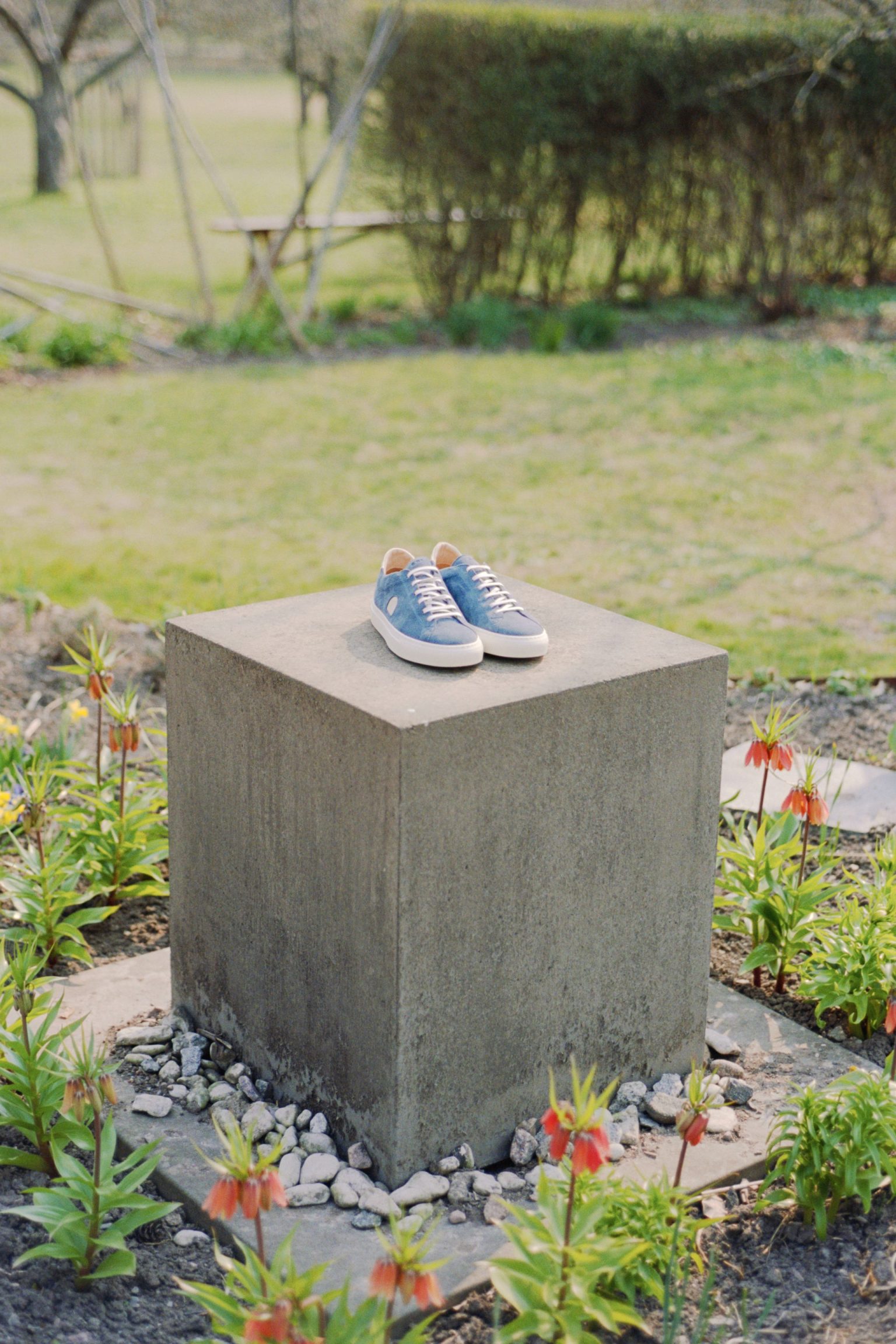 a pair of shoes on a concrete block