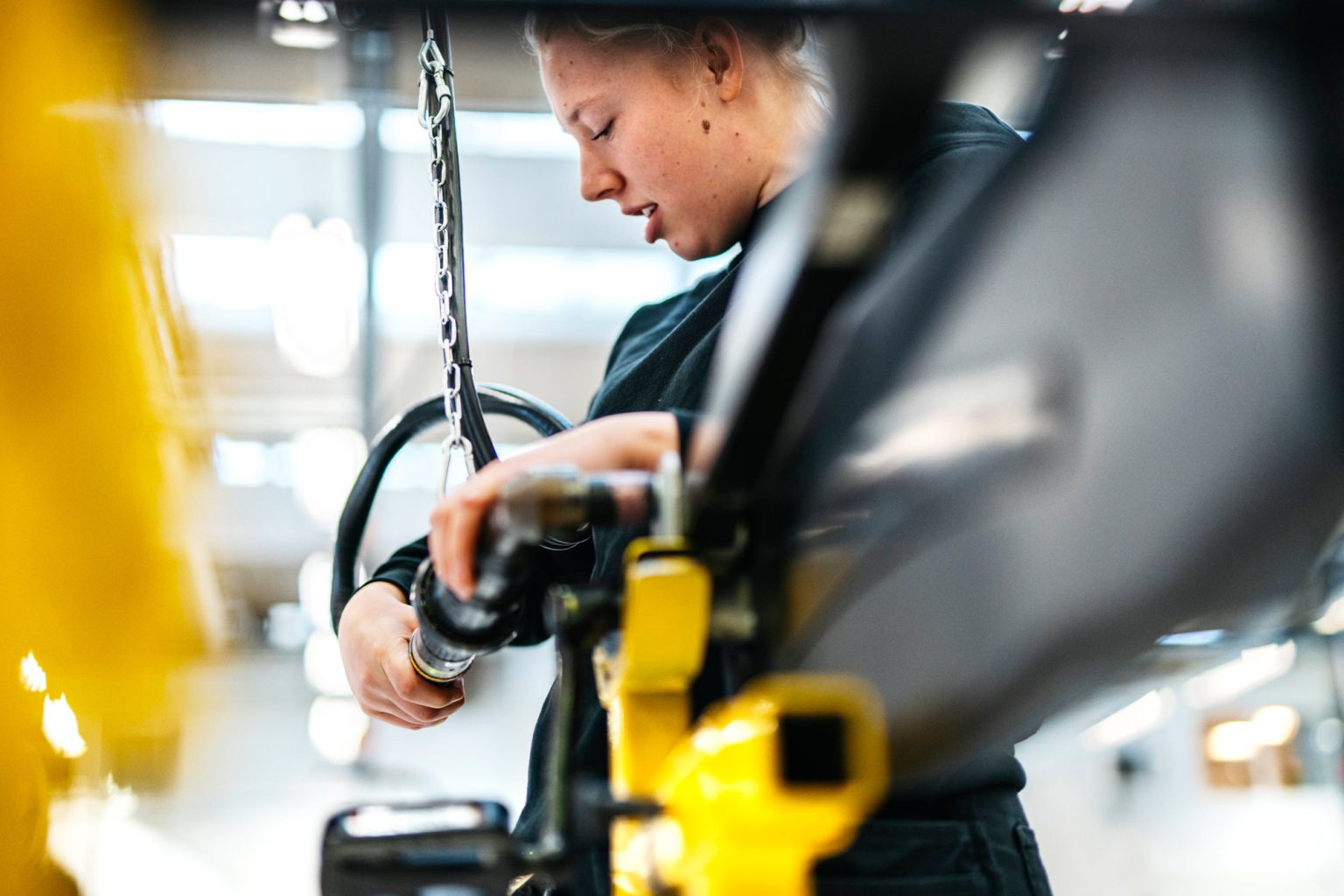 a woman working on a machine