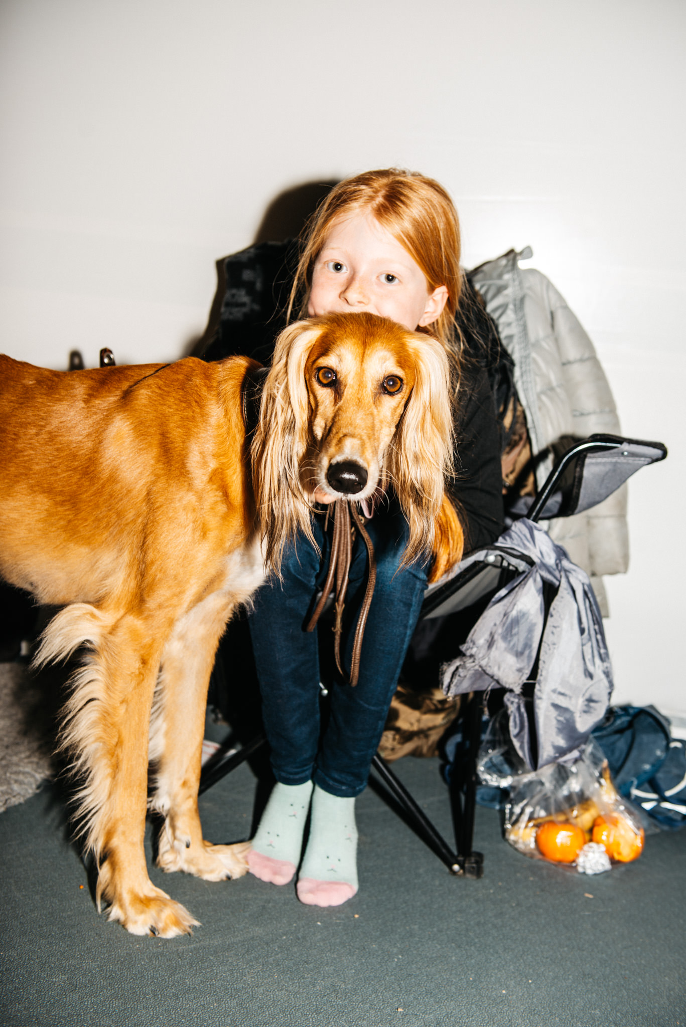 a girl holding a dog