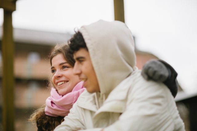 a man and woman smiling