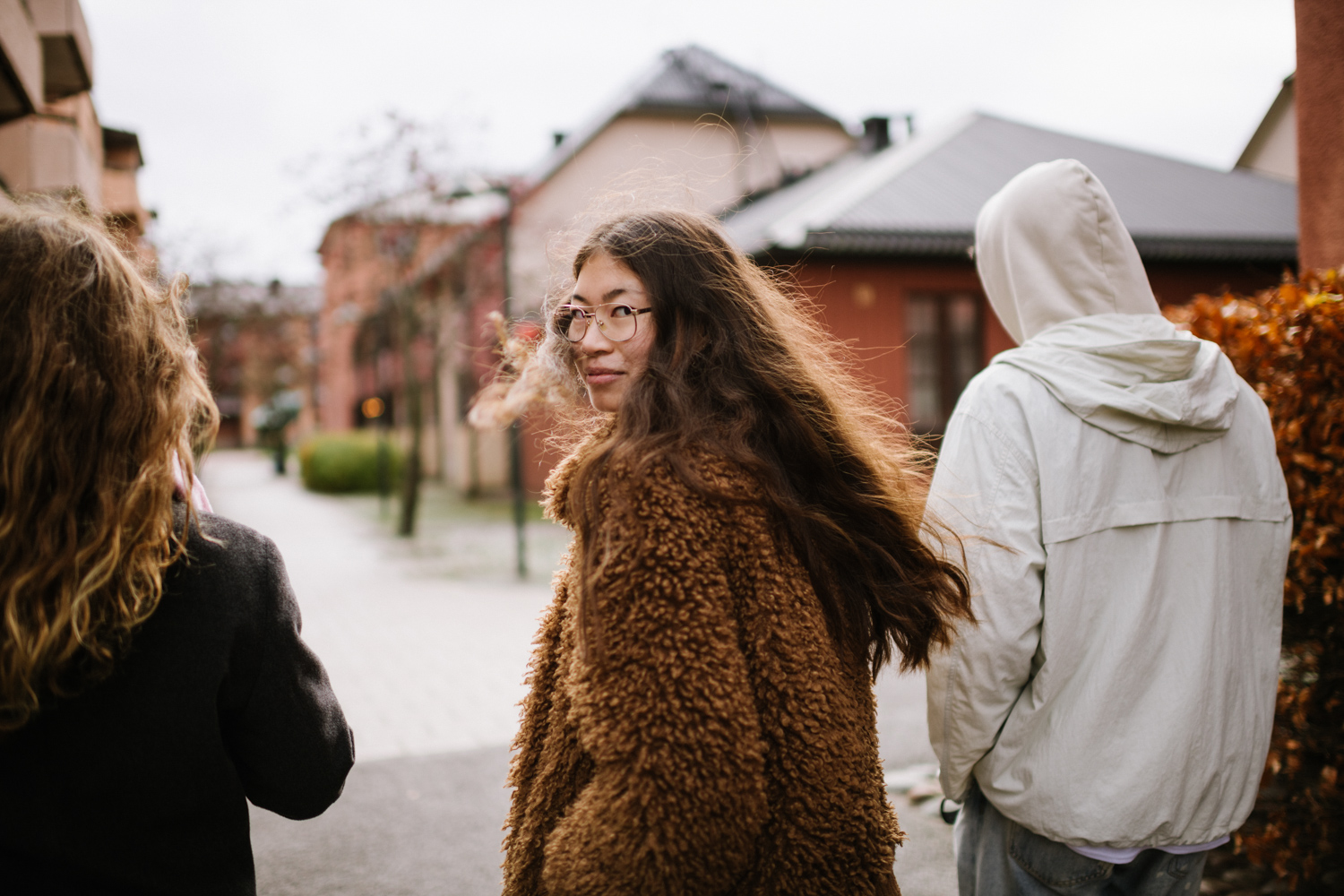 a woman in a brown coat