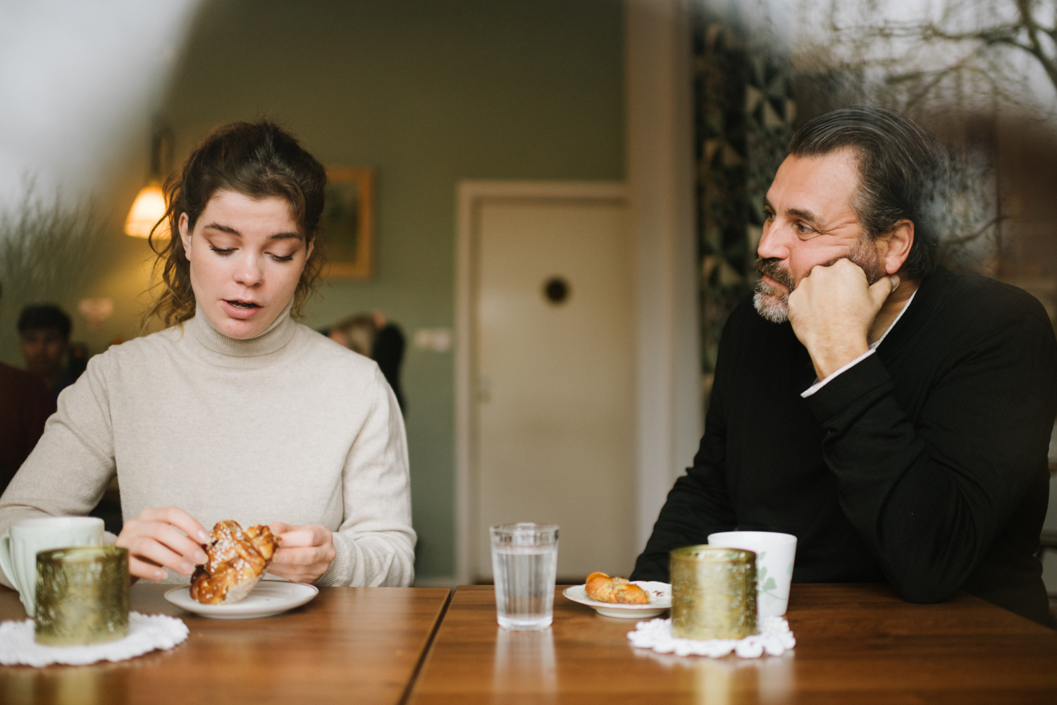 a man and woman sitting at a table