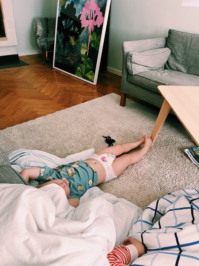 a baby lying on the floor