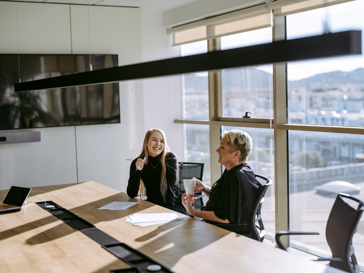 two women sitting at a table