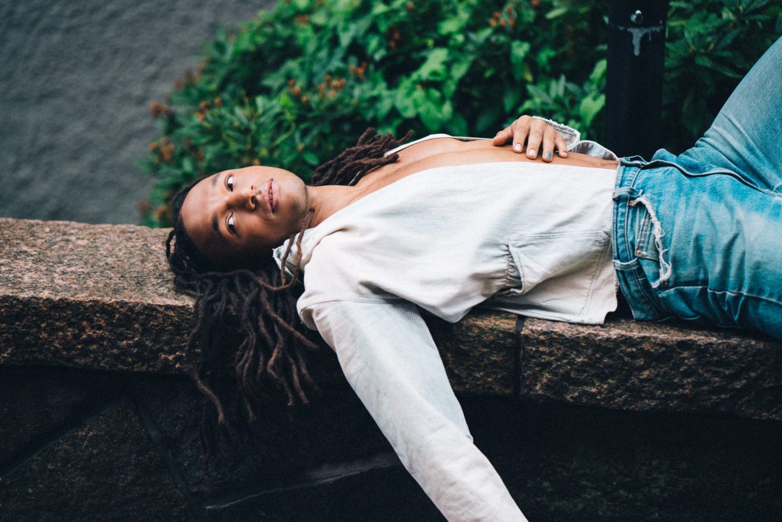 a man lying on a ledge