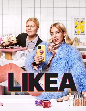 a woman holding a phone and a tray of food