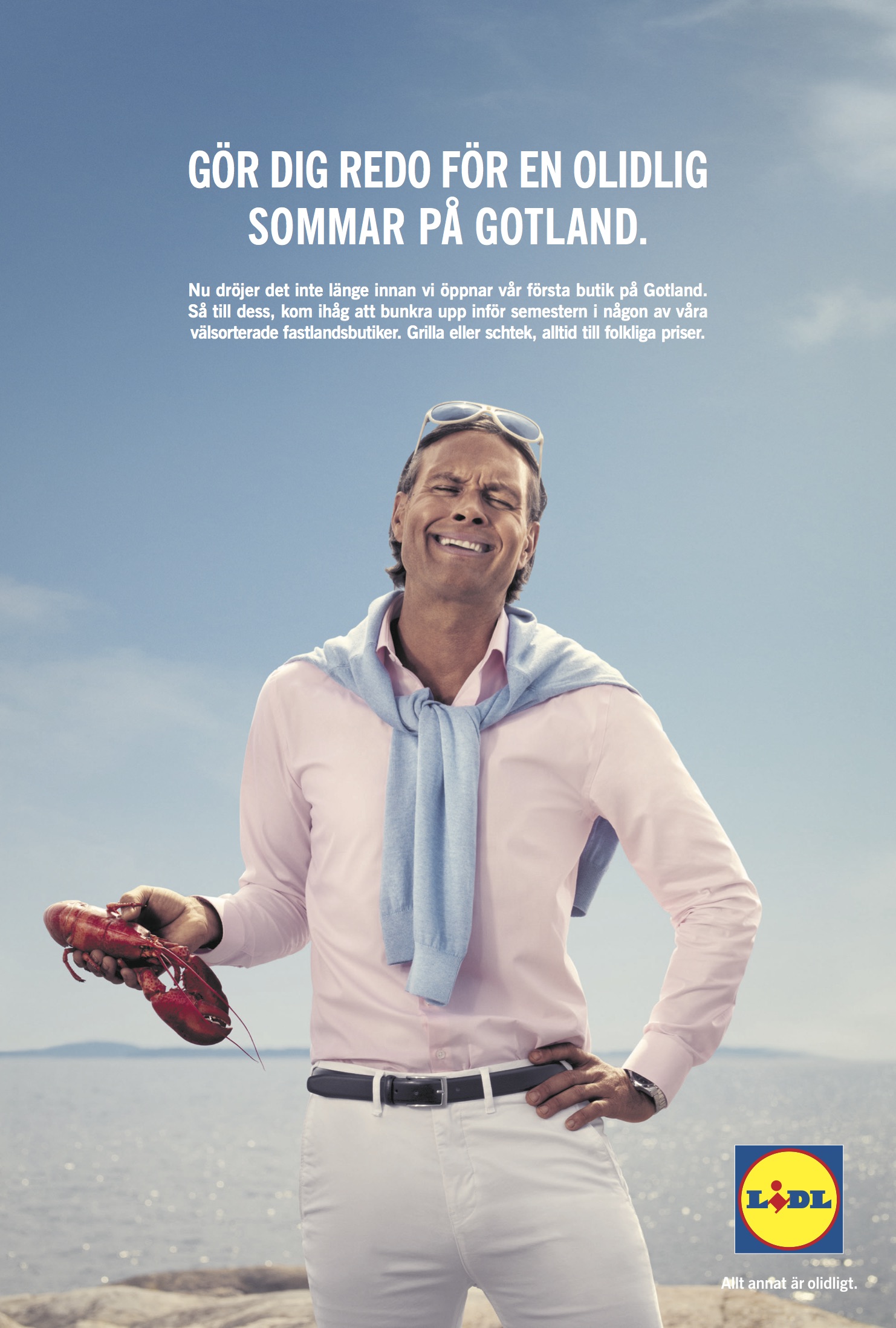 a man smiling with a lobster