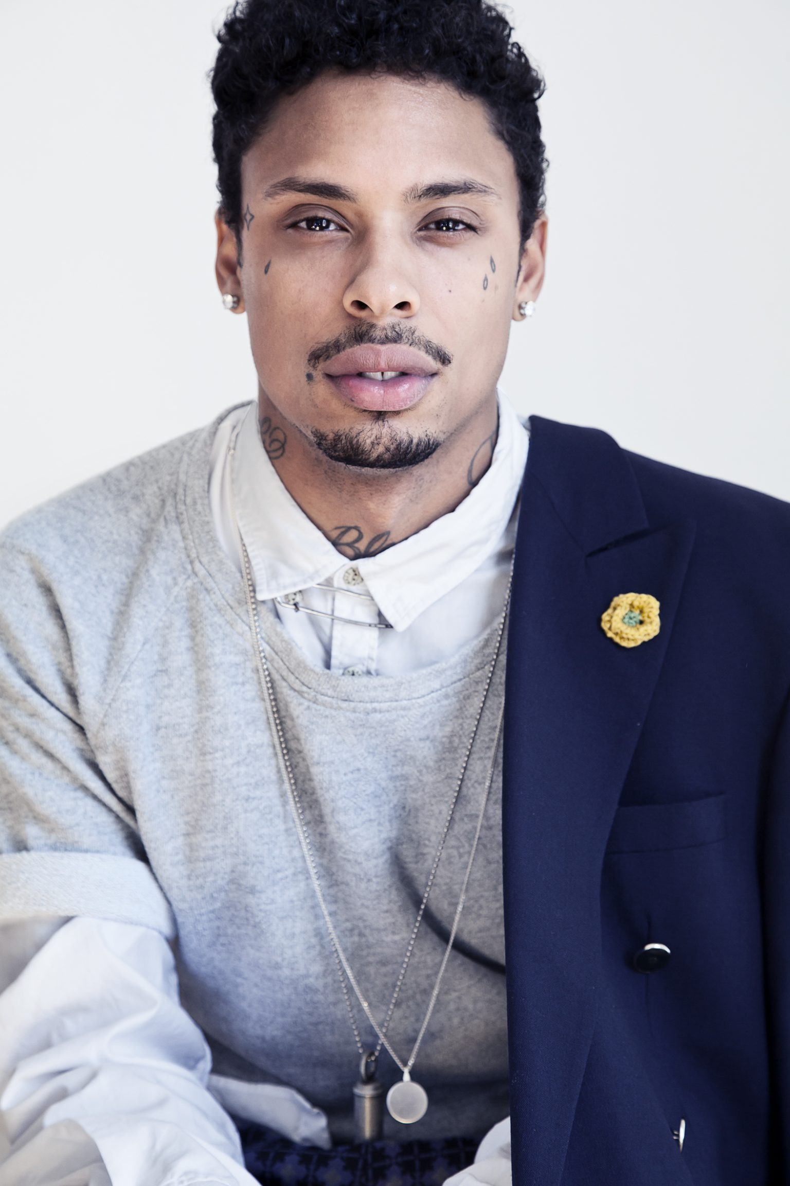 a man with tattoos on his face