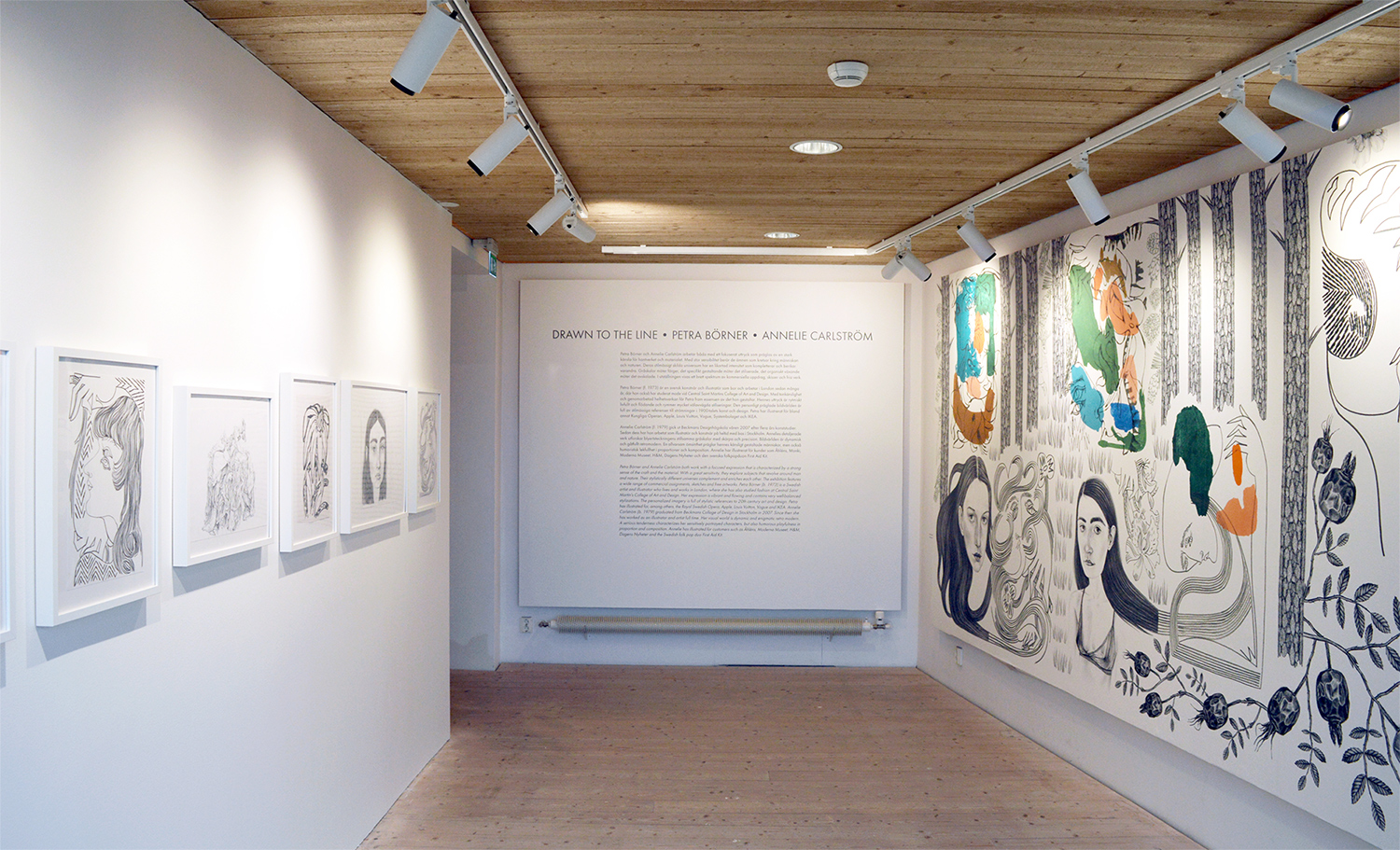 a room with a white board and pictures on the wall