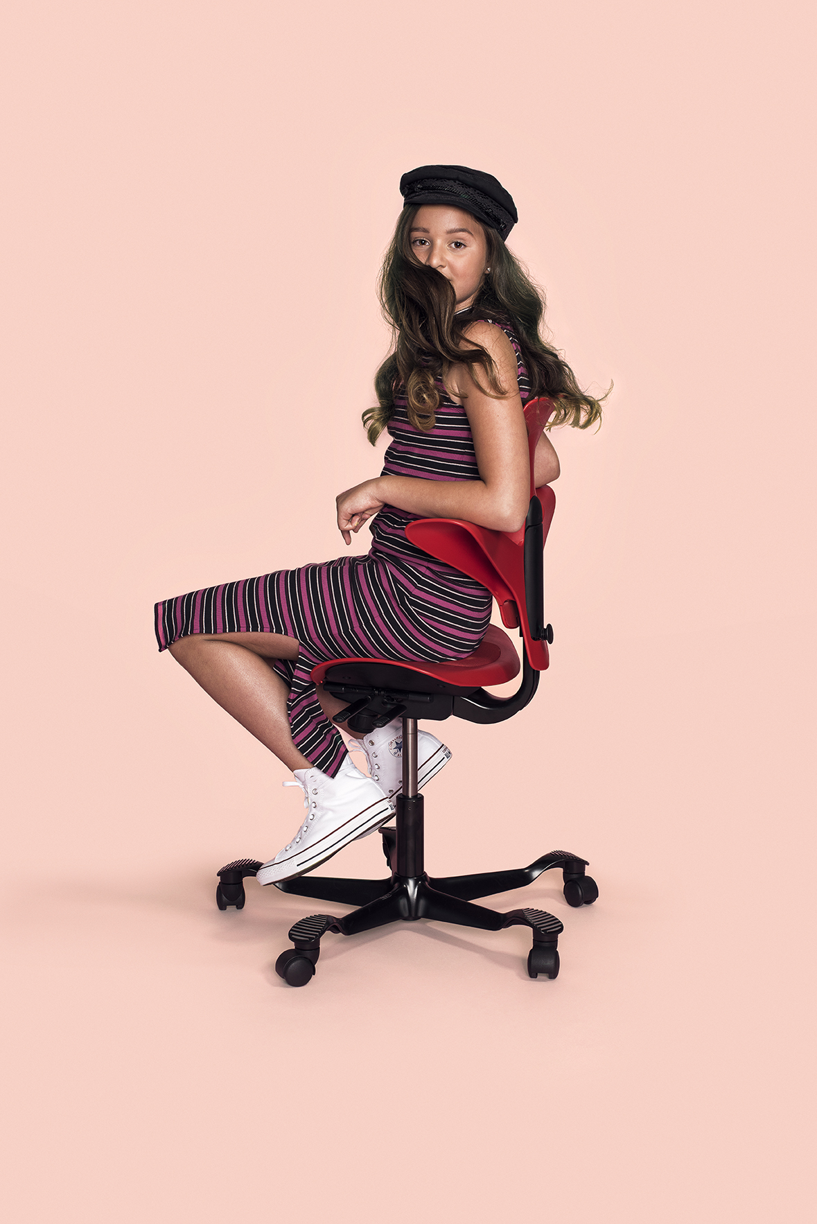 a girl sitting on a chair