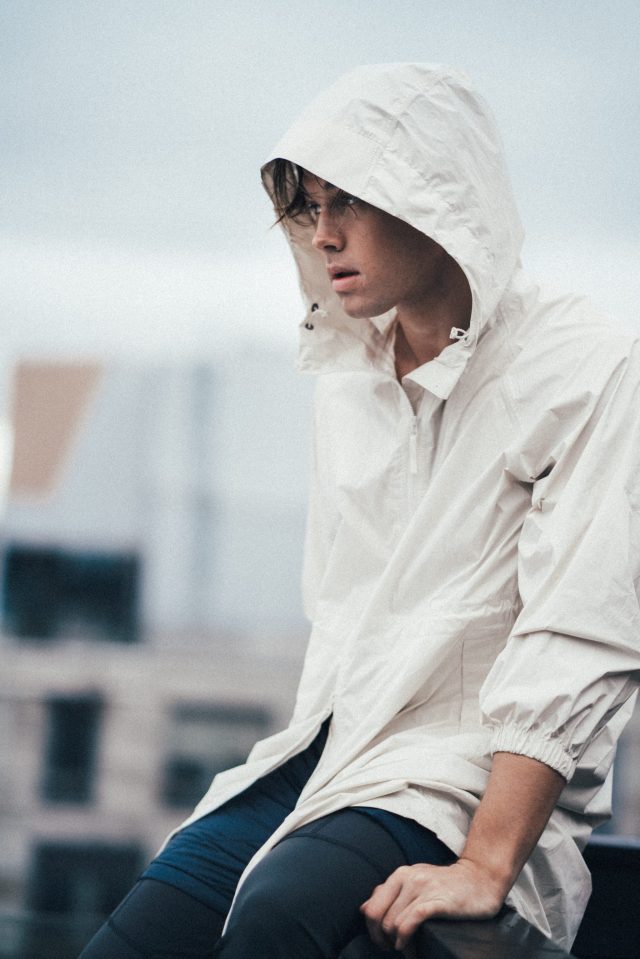 a man wearing a white jacket