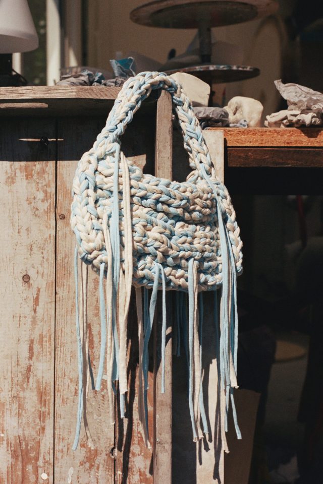 a handbag on a wood surface