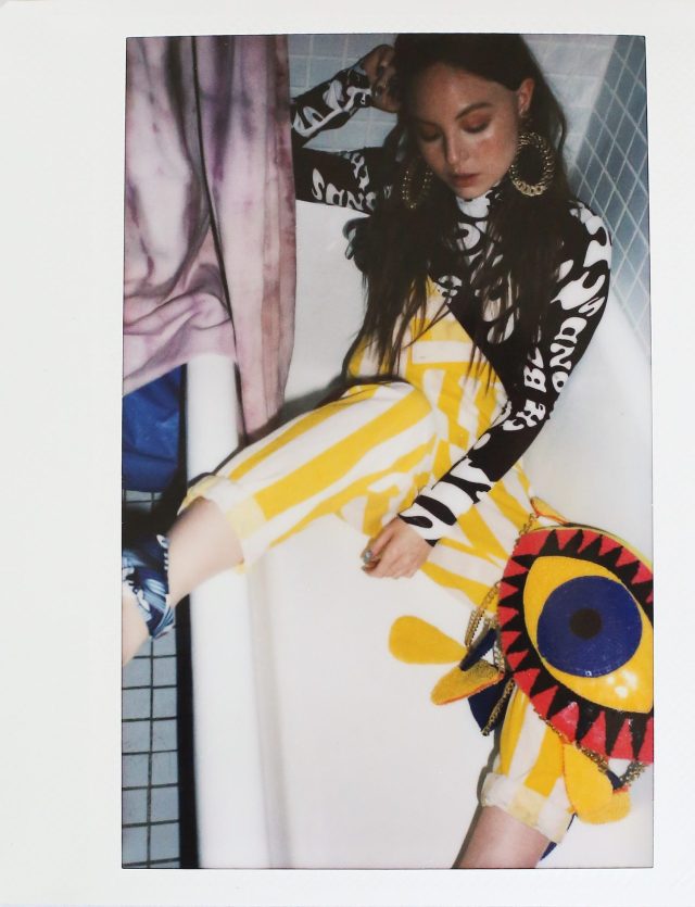 a woman sitting in a bathtub