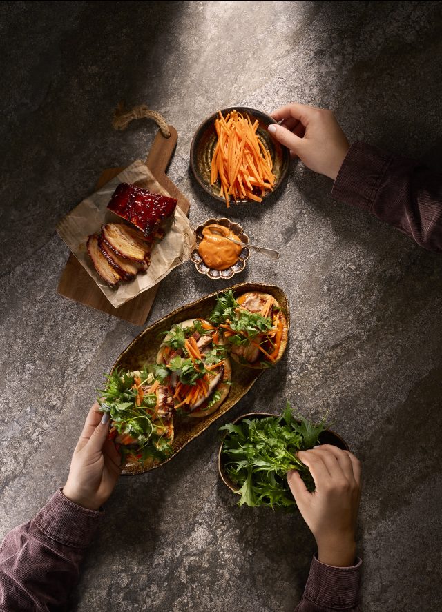 a person holding a plate of food