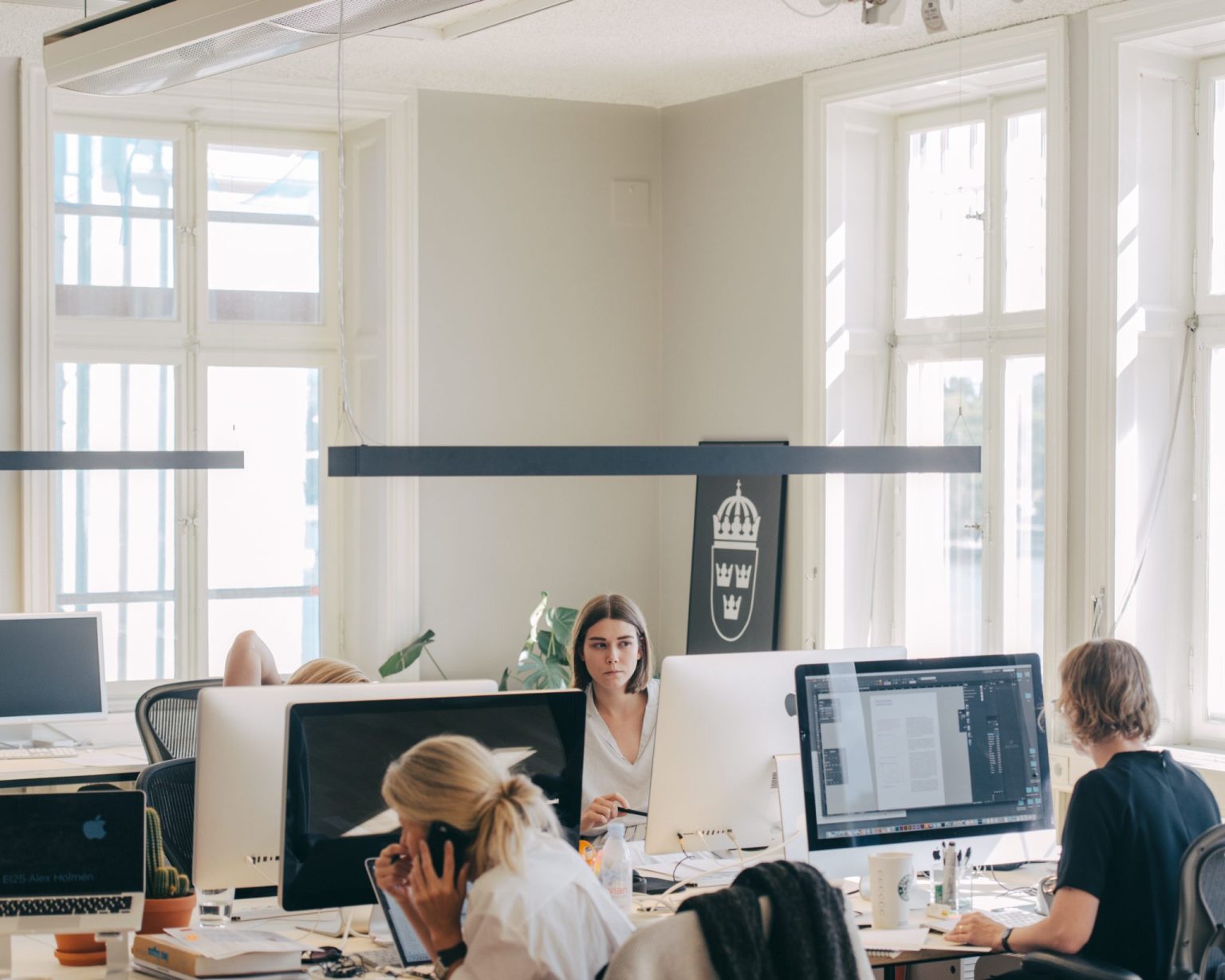 a group of people sitting at computers