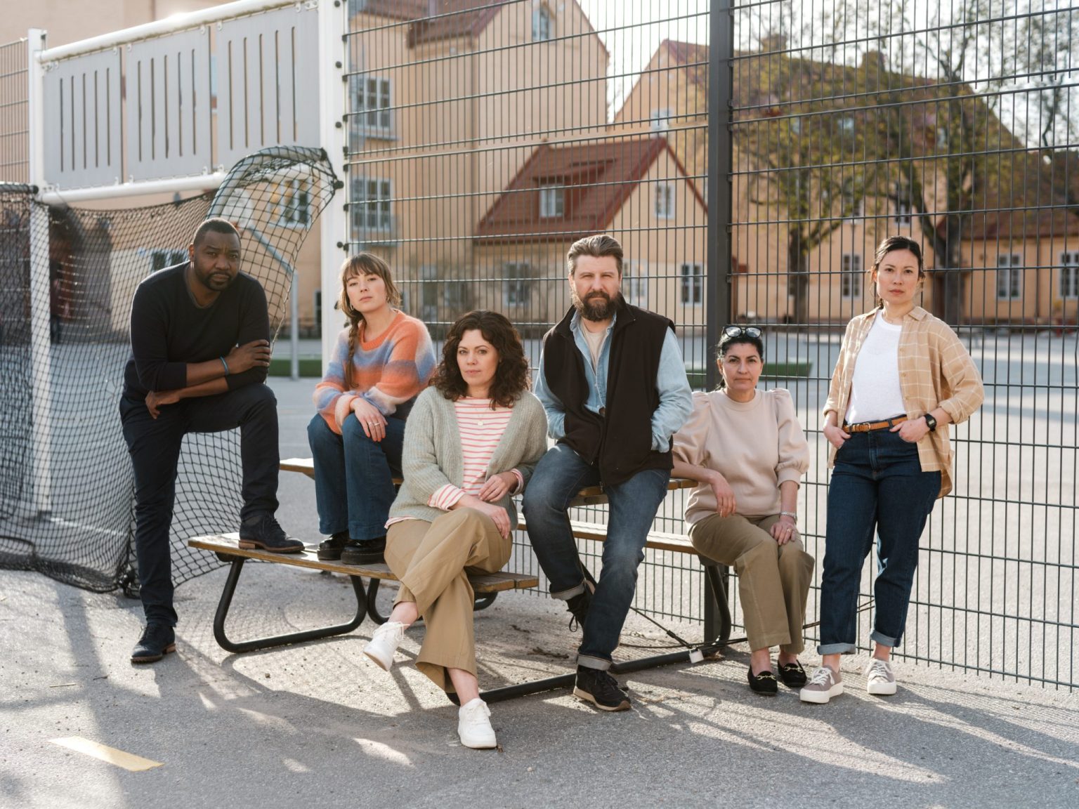 a group of people sitting on a bench