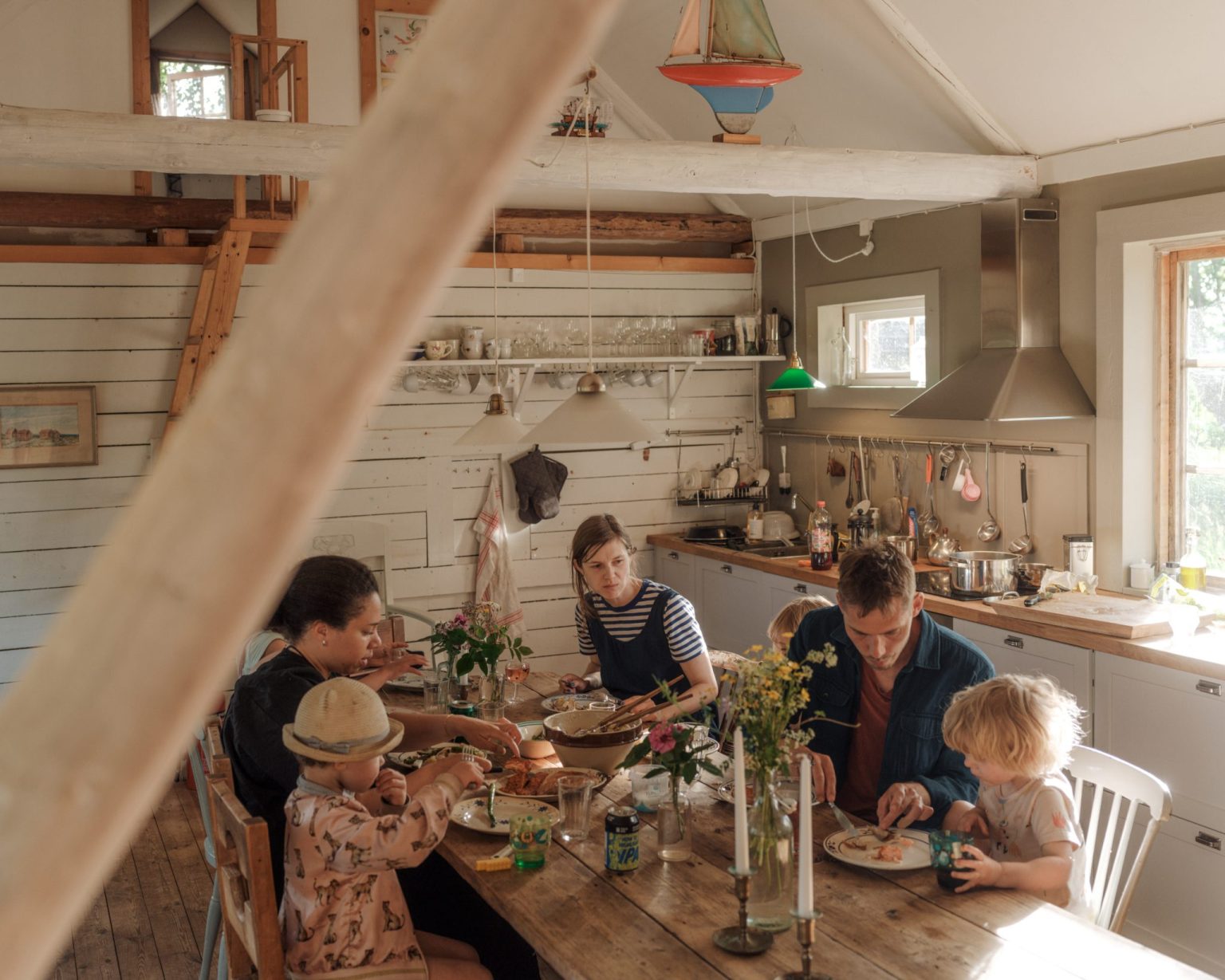 a family sitting at a table eating food