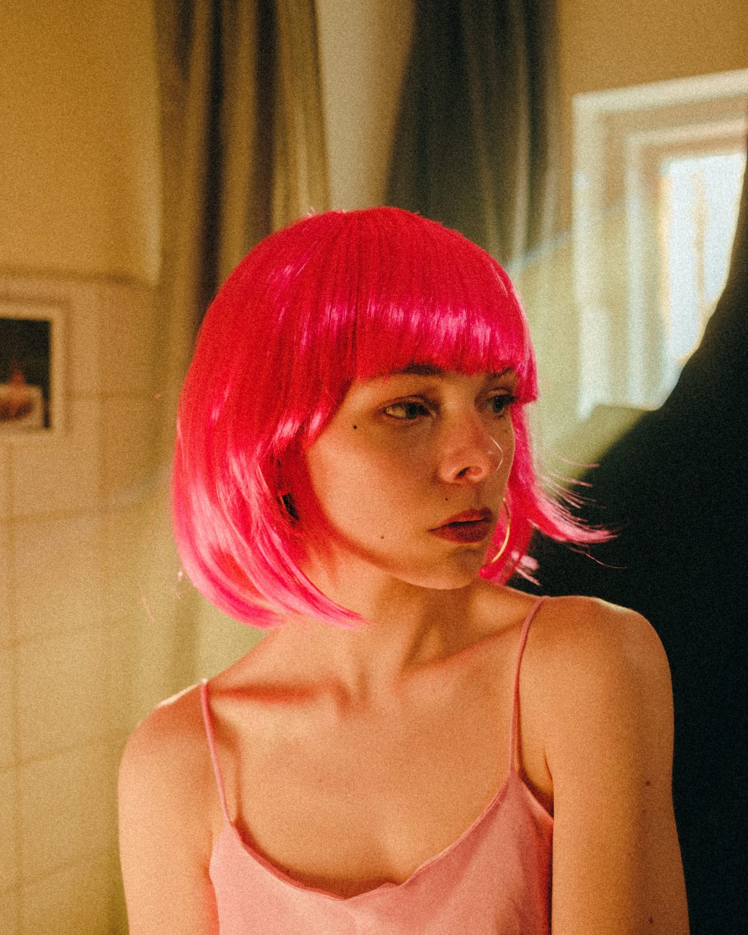 a woman with pink hair