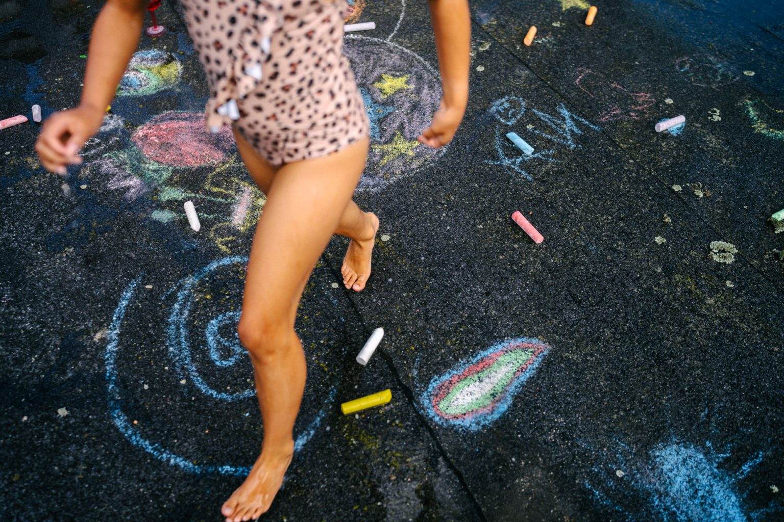 Colorful photoshoot with kids on the studio roof, with a big pool and water guns.