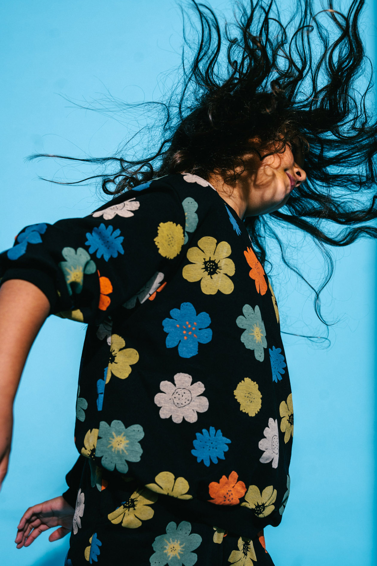 Colorful photoshoot with kids on the studio roof, with a big pool and water guns.
