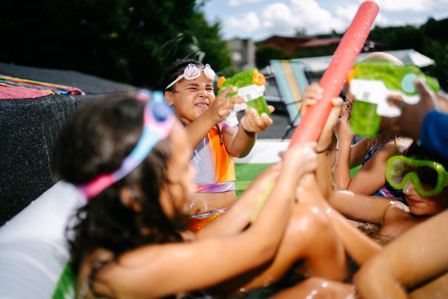 Colorful photo session with kids in the pool.