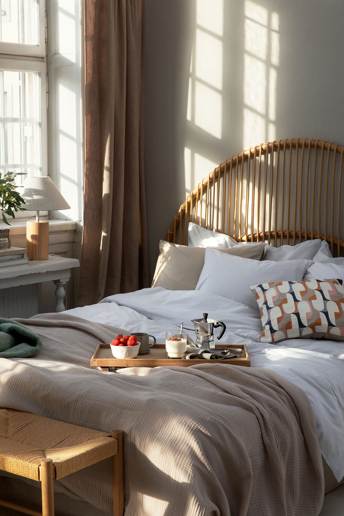a bed with a tray of food on it