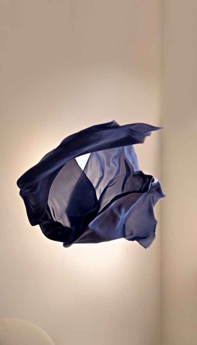 a blue fabric in the air