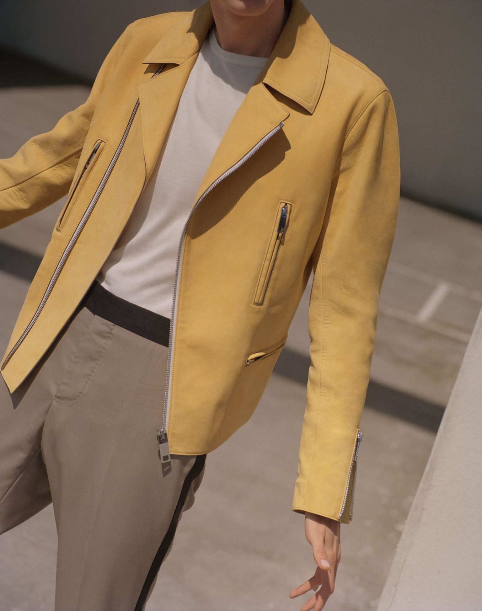 a person wearing a yellow jacket